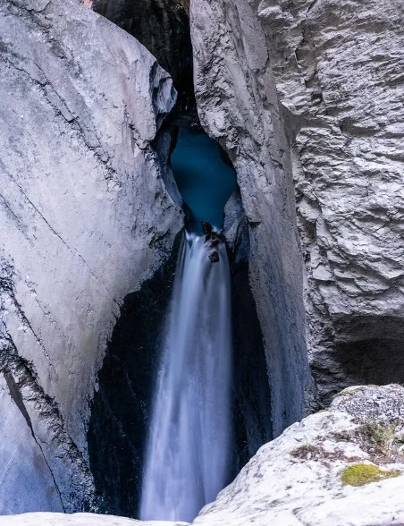 Trümmelbach Falls cascading through the cliffs in Stechelberg, Switzerland.